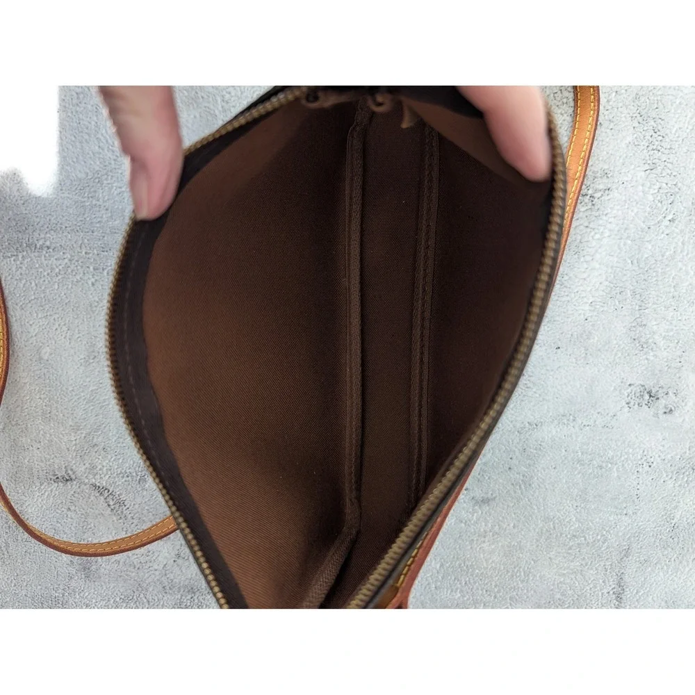 Pochette Accessories with COA crossbody strap and dust bag.